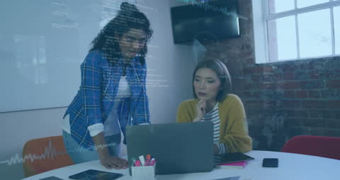 Diverse Coworkers Analyzing Data on Digital Interface