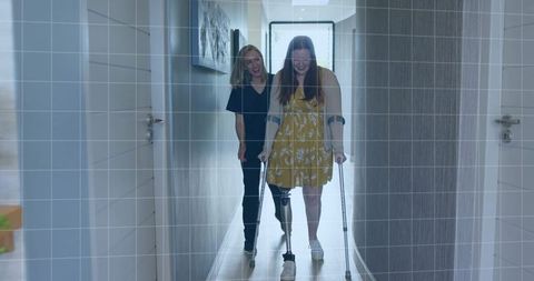 Patient with Prosthetic Leg in Rehabilitation with Therapist Support