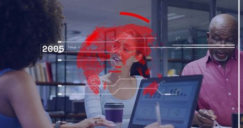 Korean woman presenting analytics over laptop with colleagues, HUD world map overlay