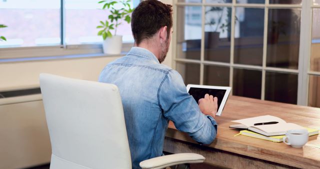 Man Using Tablet in Home Office - Download Free Stock Images Pikwizard.com