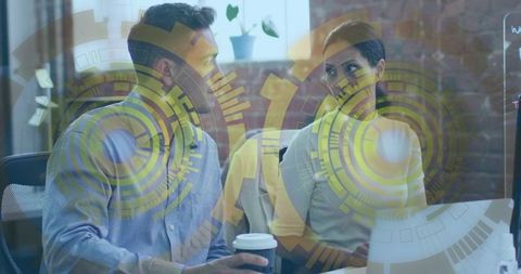 Professional coworkers collaborating on innovative project in modern office