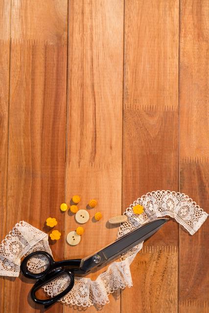 Scissors with Lace and Buttons on Wooden Table - Download Free Stock Photos Pikwizard.com