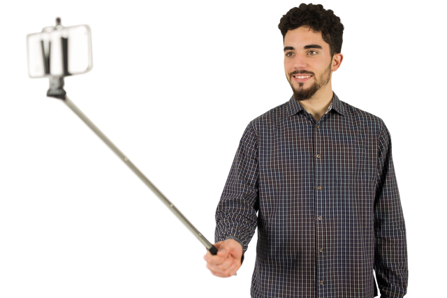 Casual man using selfie stick on transparent background in studio setting - Download Free Stock Videos Pikwizard.com