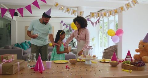 Family Birthday Celebration at Home with Cake and Balloons