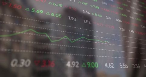 Digital Financial Data and Graphs Over Cityscape