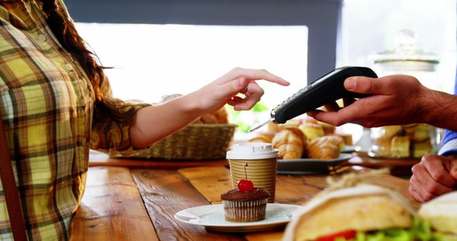 Female Customer Making Contactless Payment in Café - Download Free Stock Images Pikwizard.com