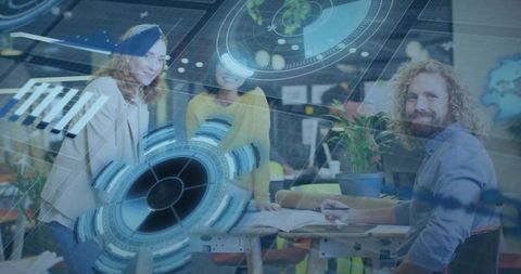 Collaborating team leaning over plans with futuristic hud overlay