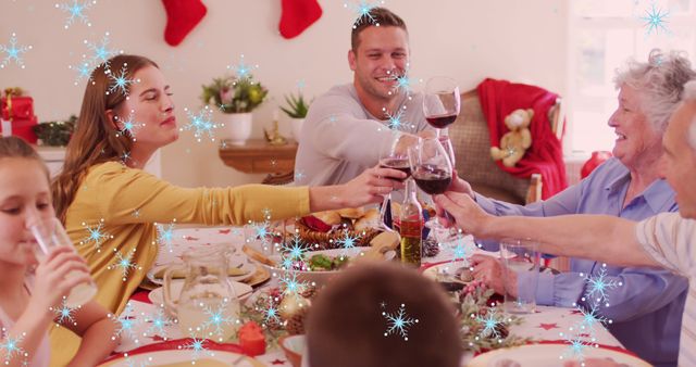 Family Celebrating Holiday Meal with Toast and Laughter - Download Free Stock Images Pikwizard.com