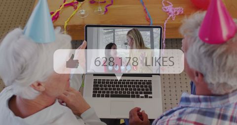 Senior Couple Enjoying Lively Video Call Party Celebration