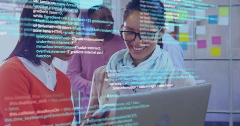 Female tech lead presenting live code on laptop while leading collaborative team