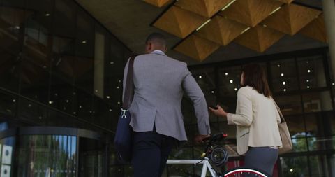 Professionals Arriving at Modern Office with Bicycle