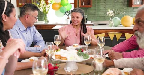 Diverse Seniors Enjoying Conversation at Celebration Dinner