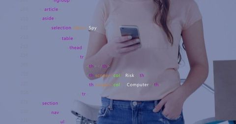 Woman holding smartphone checking messages with code overlay in casual home workspace