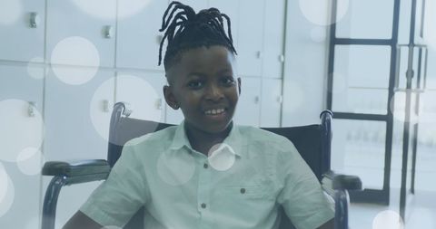 Smiling boy in wheelchair symbolizes happiness and support