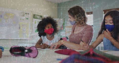 Multiracial Schoolchildren and Teacher in Classroom with Math Equations
