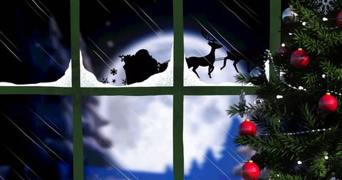 Santa and Sleigh Silhouette from Snowy Winter Window