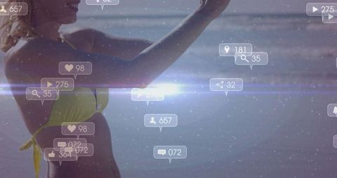 Beach influencer taking selfie in yellow bikini, social media notifications and lens flare