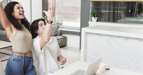 Happy Couple Celebrating Success in Living Room with Laptop - Download Free Stock Images Pikwizard.com