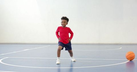 Energetic Boy on Basketball Court