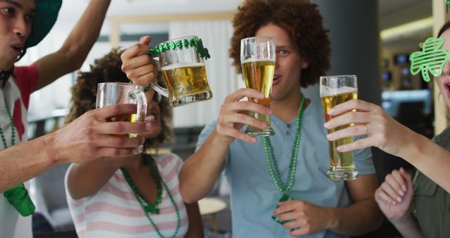 Group of friends celebrating St. Patrick's Day, clinking glasses of beer. They are wearing green accessories and enjoying each other's company. Ideal for content expressing holidays, friendship, party vibes, and cultural festivities.