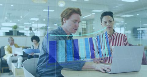 Team Analyzing Business Data with Digital Interfaces