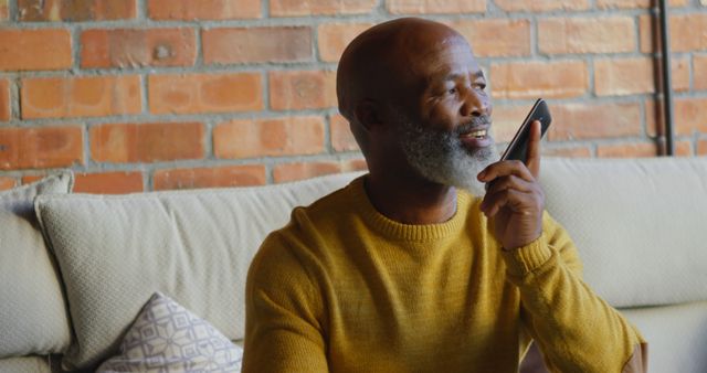 Smiling Mature Man Using Voice Command on Smartphone at Home - Download Free Stock Images Pikwizard.com