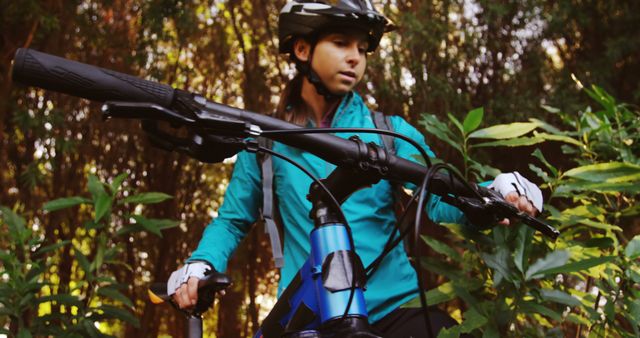 Female Cyclist Pausing During Mountain Bike Ride in Forest - Download Free Stock Images Pikwizard.com