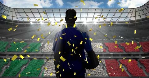 Rugby Player Celebrates Victory Under Golden Confetti in Stadium