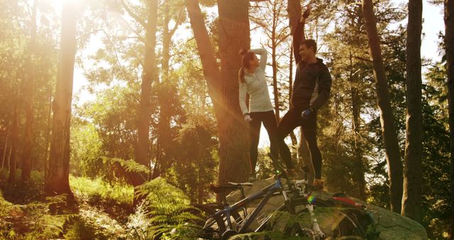 Couple Enjoying Scenic Forest Walk with Bicycles - Download Free Stock Images Pikwizard.com