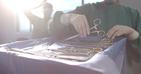 Surgeon Preparing Surgical Instruments in Theater - Download Free Stock Images Pikwizard.com