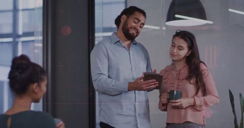 Coworkers Reviewing Project Details in a Modern Office