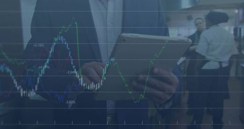 Businessman holding tablet analyzing financial charts overlaid on bustling café background