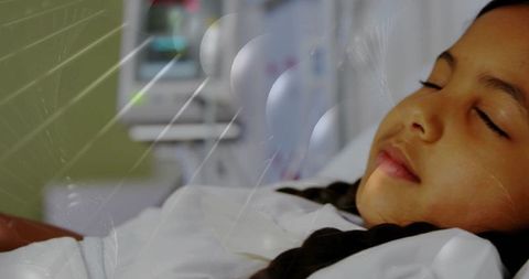Sleeping child receiving gentle hospital care with monitoring and caregiver presence