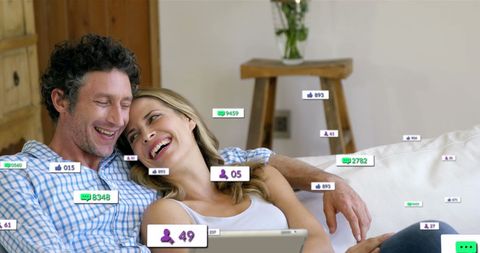 Happy Couple Engaging on Social Media Together