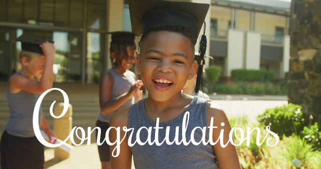 Young boy celebrating graduation wearing cap and gown outdoors. Perfect for educational materials, school event invitations, success stories, motivational content, and promoting academic achievements.