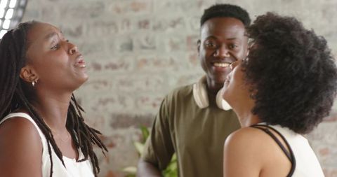 African american friends singing laughing in intimate casual studio session