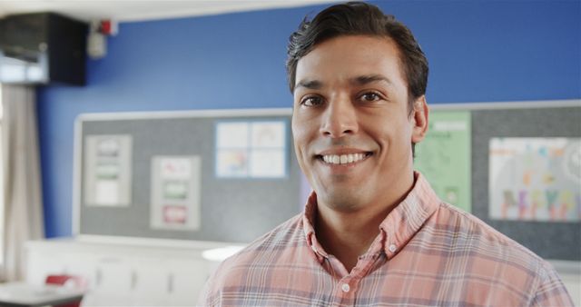 Smiling Teacher Standing in a Classroom - Download Free Stock Images Pikwizard.com