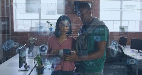 Coworkers collaborating with augmented reality HUD overlays in modern loft office