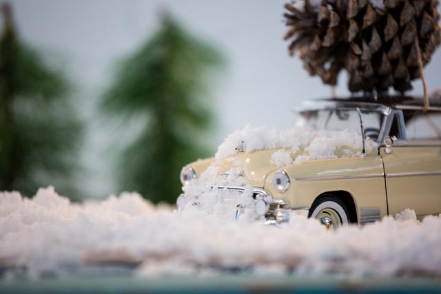 Toy Car with Pine Cone on Snowy Christmas Scene - Download Free Stock Photos Pikwizard.com