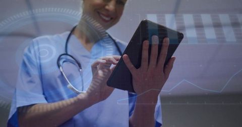 Clinician tapping tablet with hud health-data overlay for digital patient monitoring