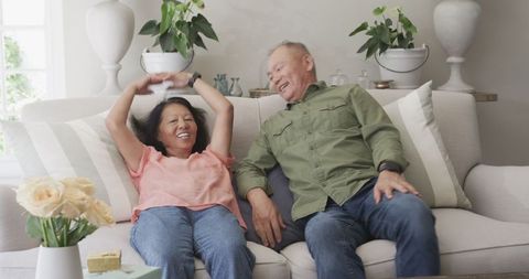 Happy Senior Couple Enjoying Leisure Time at Home