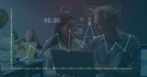 Business Professionals Analyzing Data in Office Environment with Graph Overlay