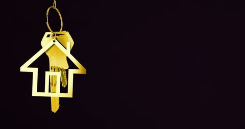 Suspended Golden Keychain with House Symbol in Luxurious Design