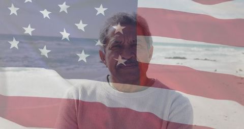 Senior Hispanic Man at Beach with American Flag Overlay