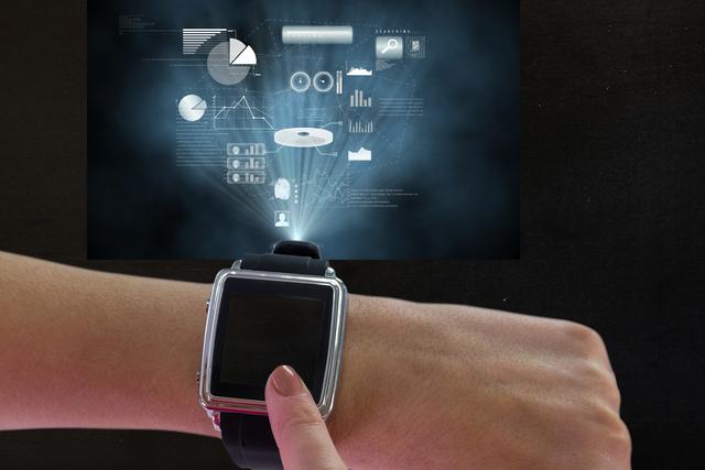 This image shows a finger interacting with a smart watch, projecting a holographic data display. Ideal for use in articles or advertisements related to wearable technology, innovation, and futuristic gadgets. It can also be used in presentations about digital interfaces and tech trends.