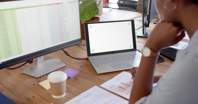 Businesswoman Analyzing Financial Data on Computer and Laptop - Download Free Stock Images Pikwizard.com