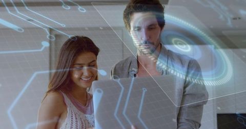 Collaborating on data visualization with laptop and futuristic hud interface in office