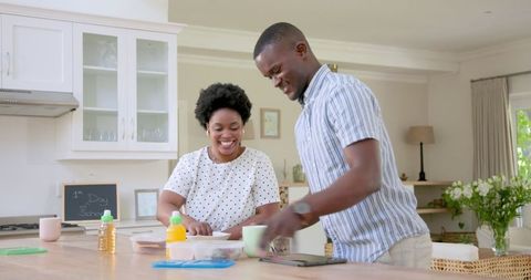 African American Family Enjoying Breakfast Together in Bright Kitchen