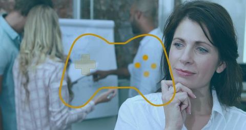 Businesswoman Contemplating Gaming Strategy in Dynamic Meeting