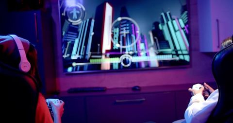 Teenage girls engaged in nighttime gaming session